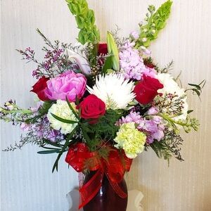 Elegant Floral Arrangement in Red Vase